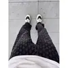 Calça jeans boca de sino com estampa jacquard all-over preta para homens, estilo high street europeu e americano, perna reta, caimento solto, calça casual de perna larga
