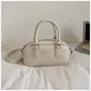 Bolso de Mano Pequeño Plateado Transfronterizo para Mujer 2026 Nuevo Estilo de Nicho Moda Coreana Bolso de Hombro Versátil Bolso Cruzado Simple