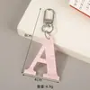 Chaveiro simples de 26 letras transfronteiriço pingente de chaveiro de letra inglesa de resina pingente de chaveiro de mochila da moda