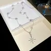 Set de Pendientes y Collar de Estrella de Zircón Súper Brillante y Perla Modelo Nuevo 2026 Joyería Exquisita de Lujo Ligero de Gama Alta