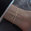 Joyería de moda europea y americana cadena de eslabones de doble capa exquisita pulsera que combina con todo tendencia acero titanio chapado en oro joyería para novias