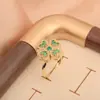 Anillo de Trébol de Cuatro Hojas Floral Chapado en Oro Cobre con Circonita, Anillo Giratorio Ajustable para Mujer, Diseño Floral Elegante y Único, Gama Alta