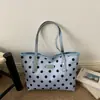 Bolsa de cubo de lunares de alto valor para el verano 2026 Bolso de hombro individual con personalidad elegante Bolso de mano estampado para el trabajo y el trayecto