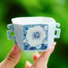 Taza de té pequeña de doble asa Zui Mo Blue Gardenia del fabricante, taza de té personal de cerámica para uso doméstico, juego de té Kung Fu