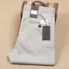 Pantalones rectos de algodón elástico de tela de lyocell fina para primavera y verano para hombre, pantalones casuales de negocios de cintura media de fibra delgada para hombre