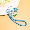 Venta al por mayor de pequeños, frescos, estilo coreano, flor de girasol acrílica, flor de goma suave, cordón trenzado hecho a mano, accesorios para cordón de teléfono