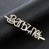 Logo personalizado de aleación de zinc marca de abrigo de invierno herrajes personalizados grabado láser señal de sombrero de aleación de comercio exterior