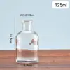 Botella de reactivo de boca ancha al por mayor, botella de vidrio con tapón de corcho, botella sub-botella de medicina de laboratorio, botella transparente sellada de boca ancha al por mayor