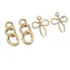 Pendientes de Botón de Perla y Lazo Elegantes de Moda Tongle Diseño de Nicho Cadena Triple Incrustada de Diamantes Pendientes Elegantes Venta al por Mayor