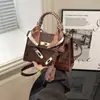 Bolso de nicho francés para mujer, nuevo bolso Kelly con patrón de piedra retro, bolso de mano vintage, bolso cruzado de moda