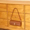 Bolso de axila de nicho de alta gama estilo coreano, bolso de mano versátil chic vintage, bolso baguette simple personalizado para el día a día