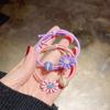 Versión coreana de cuerda simple para el pelo femenina niña linda pelo pequeña liga de goma cuerda para la cabeza pequeña Margarita cara sonriente anillo para el pelo venta al por mayor