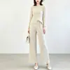 Moda feminina de alta qualidade de Shenzhen Nanyou, conjunto sofisticado com top de gola redonda e manga longa e calça pantalona fluida de cintura alta, inspirado em Issey Miyake