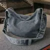 Bolsa jeans para mulheres, novo modelo 2026, casual e estilosa, adequada para a faculdade e o trabalho, bolsa tote de grande capacidade, bolsa de ombro e transversal