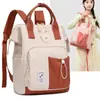 Nova bolsa de maternidade transfronteiriça, bolsa de armazenamento simples multifuncional, grande capacidade, pode ser carregada como bolsa de ombro ou bolsa de mão, mochila feminina moderna