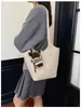 2026 nuevo bolso de mano de estilo retro de alta gama para mujer, versión coreana, bolso de hombro súper popular, bolso simple de axila, bolso tipo cubo versátil, moderno