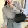 Blusa de manga longa listrada com design retrô francês de Dongdaemun, Coreia, nicho de moda, irregular, com botões diagonais, para mulheres
