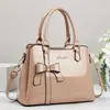 Bolso de mano para mujer 2026 nuevo modelo con lazo, piel brillante, bolso de hombro y cruzado para madres de mediana edad, bolso de dama de piel PU