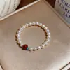 Pulsera redonda de perlas con cuentas estilo francés, lujo ligero, alta gama, moderna y exquisita, adecuada para el uso diario, accesorio versátil para mujer