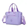Bolso de hombro nuevo de nailon 2026, bolso para mujer, ligero e impermeable, adecuado para ir al trabajo, se puede llevar en la mano o cruzar el cuerpo, mochila casual y versátil