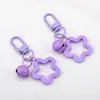 Llavero con Colgante de Campana de Estrella de Cinco Puntas de Colores Caramelo de Aleación Cubierta para Auriculares Decoración de Pareja