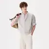 Diseñada con estilo, esta camisa de manga corta con cuello mao de dos piezas falsas para hombre es un estilo fino de verano de estilo chino nuevo con una tendencia nacional, disponible en tallas grandes y hecha de una mezcla de lino.