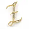 Temperamento de comercio exterior europeo y americano 26 broches de letras inglesas femenina diamante personalidad Joker moda corsage pin masculino accesorios