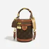 Bolsa Transversal Monica Kiki Monograma Cilindro Redondo Feminina 2026 Nova Bolsa Balde de Ombro Único e de Mão Luxo Leve Versátil Feminina