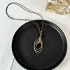 Nuevo Colgante de Collar de Múltiples Capas Dorado con Piedra Ojo de Tigre de Alta Venta Accesorios Cadena para Suéter Exquisita de Nicho de Lujo Ligero para Mujer