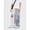 Pantalones de chándal anchos asimétricos de moda estilo americano 2026, unisex, corte holgado, tela fluida, para streetwear casual y pantalones deportivos