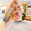Lindo creativo bebida té con leche sostener tortuga capibara muñeco llavero colgante de bolsa llavero para llaves de coche pequeño regalo