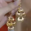 Pendientes de Borla Estilo Europeo y Americano Súper Brillantes con Ramas Doradas y Hojas de Jade, Exagerados, Elegantes y Elegantes Estilo Dama, Joyería de Oreja Popular Transfronteriza