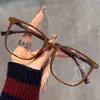 Nuevas gafas de grano de madera de marco grande para adelgazar de aspecto sencillo anti-luz azul grado ajustable espejo plano estudiante retro pequeño libro rojo