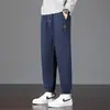 Calça de moletom moderna estilo americano para homens, calças compridas de primavera e outono, versátil e estilosa, adequada para adolescentes, joggers atléticos, calças casuais