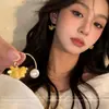 Pendientes de Borla de Osmanthus de Hada Súper con Perlas para Mujer 2026 Nuevo Estilo Pendientes Súper Populares Elegantes Lujo Ligero Nicho Pendientes de Alta Gama