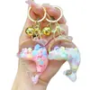 Nuevo llavero de muñeca de delfín con arena movediza relleno de aceite, colgante para mochila, decoración para bolso de pareja, regalo pequeño para venta al por mayor