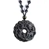 Colgante de hebilla de seguridad de dragón de hierba de obsidiana natural Hebilla de seguridad Cao long Collar de pareja al por mayor directo de fábrica