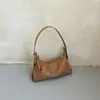 Bolso tipo dumpling de cuero suave de alta gama de estilo coreano ins, diseño de nicho, versátil para el trabajo y los desplazamientos, bolso de hombro para mujer