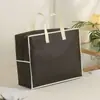 Bolsa de embalaje textil para el hogar transparente no tejida, bolsa de mano de cuatro piezas para almacenamiento de edredones, bolsa con cremallera para ropa de cama, personalizable