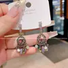Pendientes de Disco de Cristal Brillante Estilo Retro de Lujo Ligero Nicho Únicos Populares Elegantes Versátiles Pendientes para Mujer