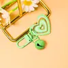 Llavero de campana con forma de corazón de purpurina de colores, colgante para bolso DIY, accesorio de campana con forma de corazón creativo, fabricante, venta al por mayor