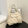 Bolsa tote casual estilo coreano con cierre de broche de presión tipo tapa abatible, con un ambiente relajado, plisado, simple y casual, adecuada para parejas, para ir al trabajo, bolso de hombro