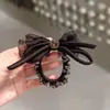 Lazo negro para el pelo para mujer, cuerda para el pelo de alta gama, goma para el pelo, accesorio para el pelo estilo coreano, nueva cuerda para el pelo y adorno para la cabeza 2026