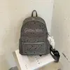 Mochila com estampa de estrelas, grande capacidade, simples e versátil, adequada para estudantes, estilo coreano, com estampas de letras e um visual preppy de faculdade.