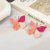 Aretes de isla hechos a mano de girasol de rafia y pasto, aretes de flores grandes exagerados de personalidad junto al mar, venta al por mayor de aretes