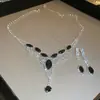 Traje de collar y pendientes de diamante ovalado europeo y americano exagerado luz de lujo alta gama cadena de clavícula nicho moda joyería al por mayor