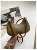 Bolso de mujer de venta caliente transfronterizo 2026 nuevo diseño de moda versátil bandolera tipo dumplings bolso de hombro tejido simple para debajo del brazo para mujer