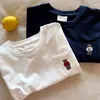Camiseta de Manga Corta de Algodón Puro para Niños Niños 2026 Verano Nuevo Estilo Camiseta con Bolsillo Bordado de Oso Bebé Color Sólido para Niñas Delgada