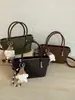 Bolso tejido de alta gama vintage para mujer, nuevo bolso cruzado versátil de moda 2026, bolso de mano para el trabajo, bolso de hombro tipo cubo