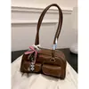 Bolsa de Commuting Maillard Feminina Primavera/Verão 2026 Bolsa de Ombro Versátil Retro Grande Capacidade Bolsa de Commuting